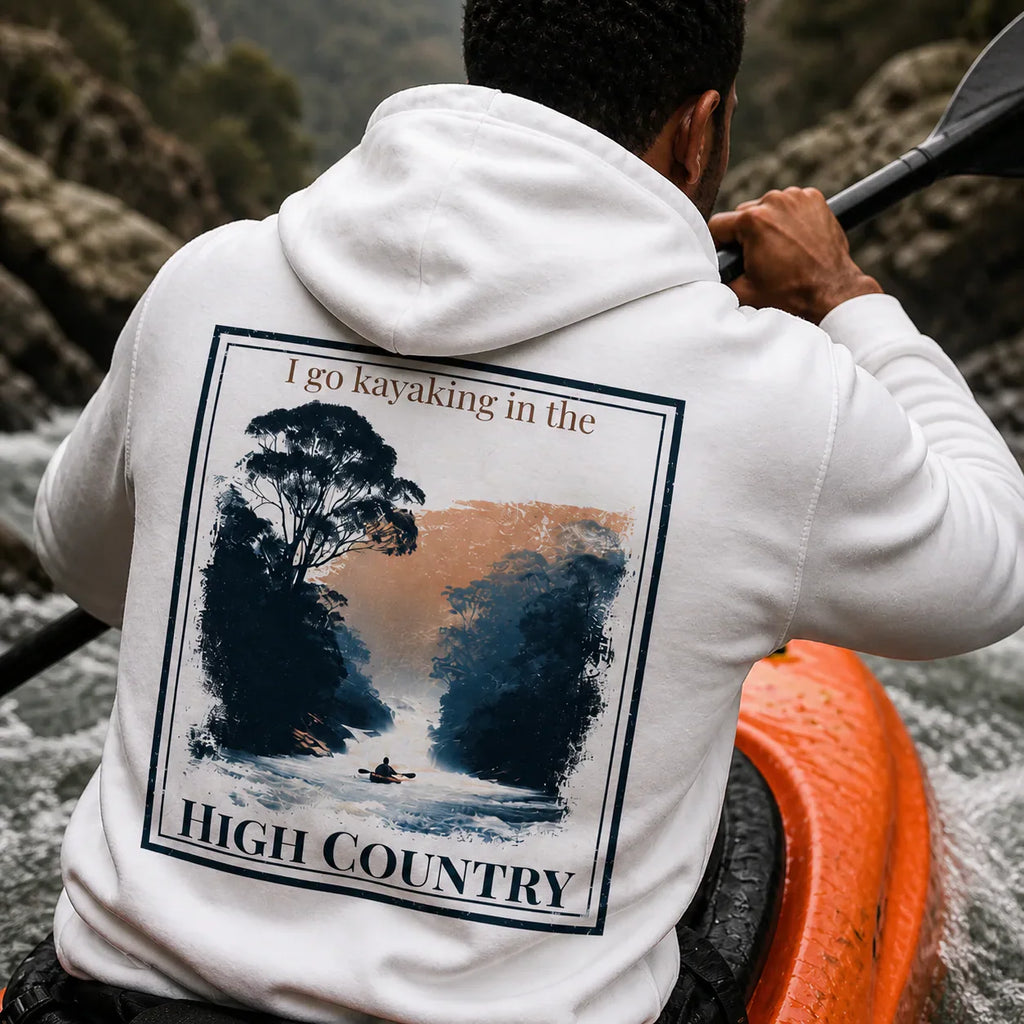 Eco hoodie, white, back graphic with “I go kayaking in the” and “HIGH COUNTRY”