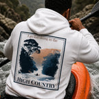 Eco hoodie, white, back graphic with “I go kayaking in the” and “HIGH COUNTRY”