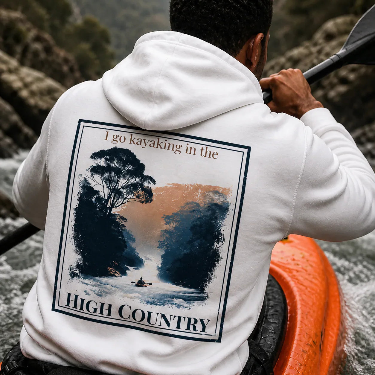 Eco hoodie, white, back graphic with “I go kayaking in the” and “HIGH COUNTRY”