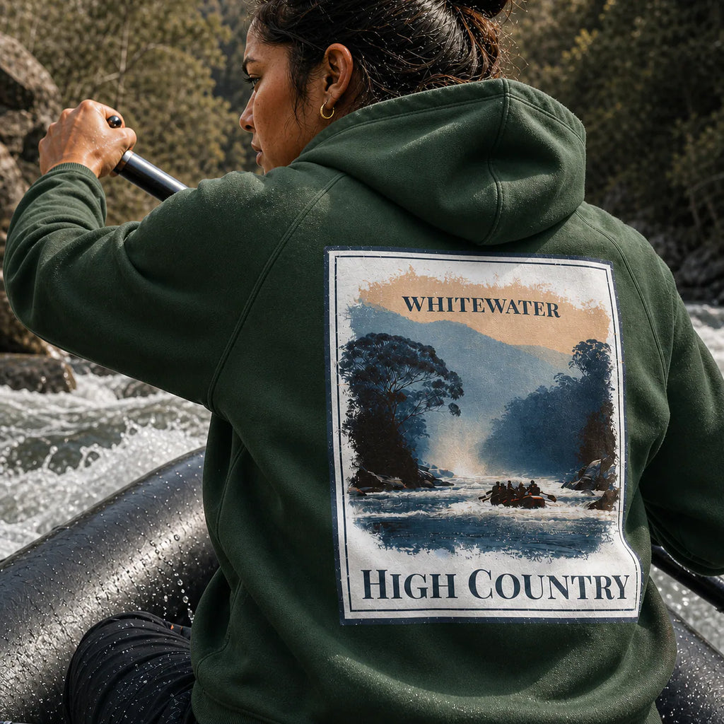 Eco hoodie in dark green with back graphic patch reading “WHITEWATER” and “HIGH COUNTRY”