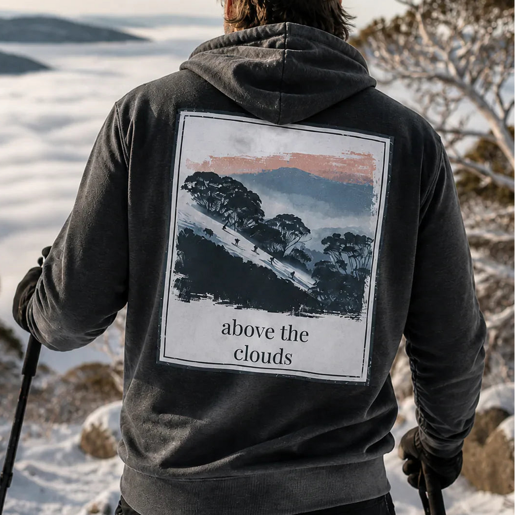 Dark charcoal hoodie with hood and large back graphic print, 'above the clouds'.