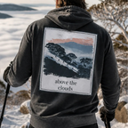 Dark charcoal hoodie with hood and large back graphic print, 'above the clouds'.