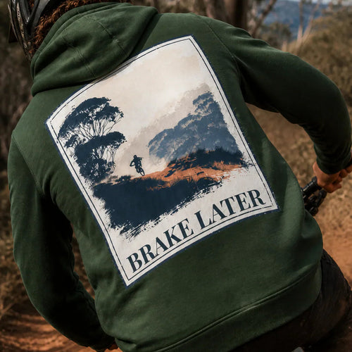 Green eco hoodie with large back graphic reading “BRAKE LATER” and rider scene.