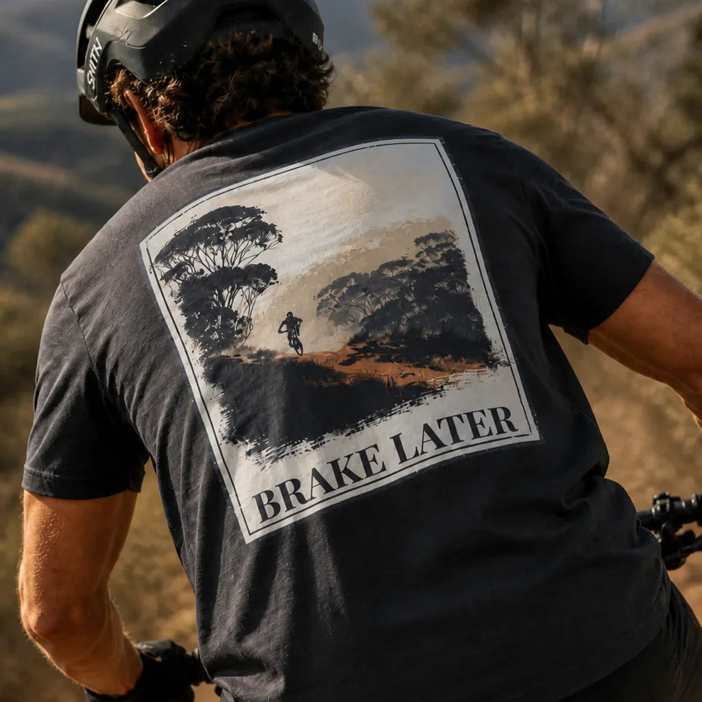 Organic Tee “Brake Later” graphic on dark grey/black back