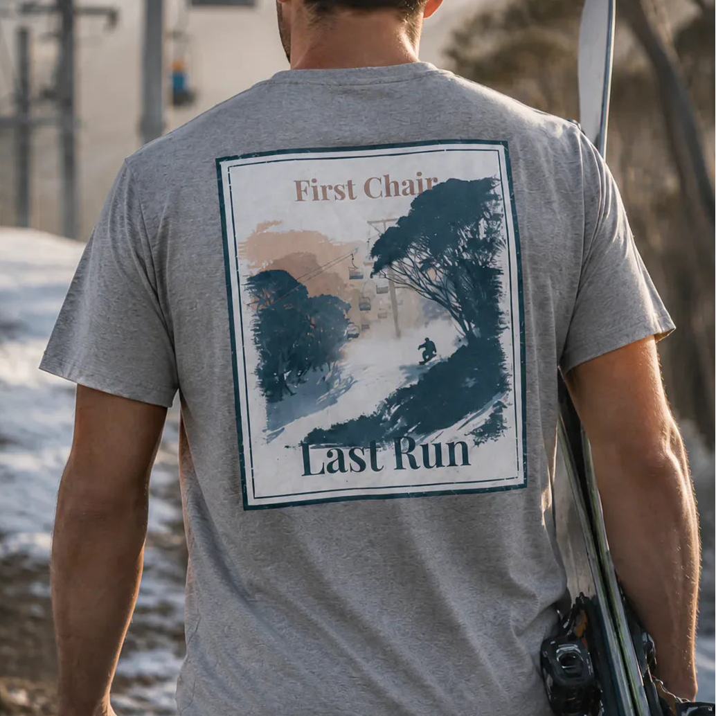 Dark heather grey T-shirt with large back graphic print, “First Chair / Last Run”