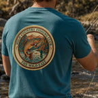Teal organic fishing tee with embroidered circular back patch, crew neck