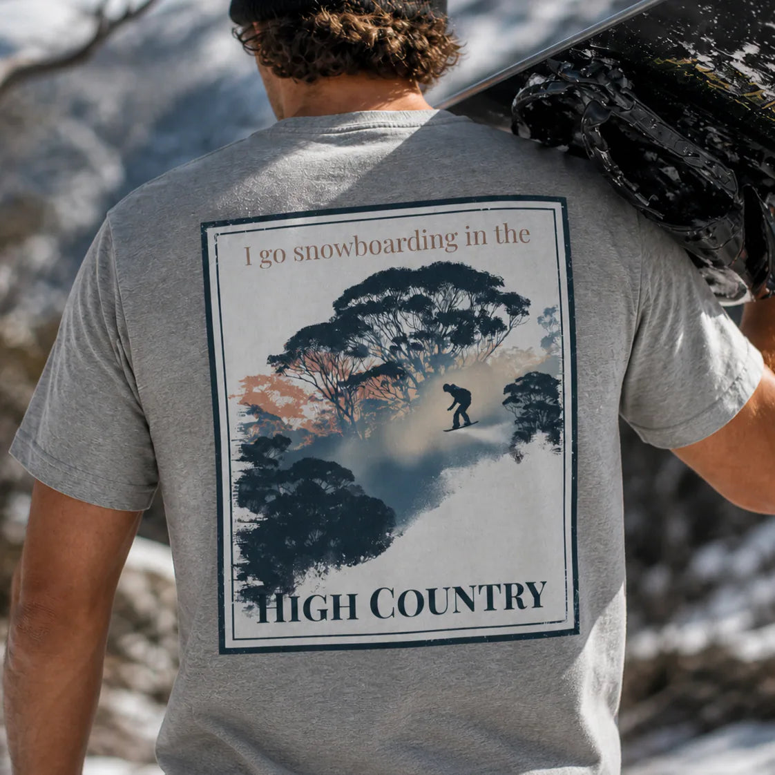 Heather grey organic tee with 'High Country' snowboard graphic on back