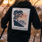 Black pullover hoodie with hood, front pocket, and large back “High Country” graphic.