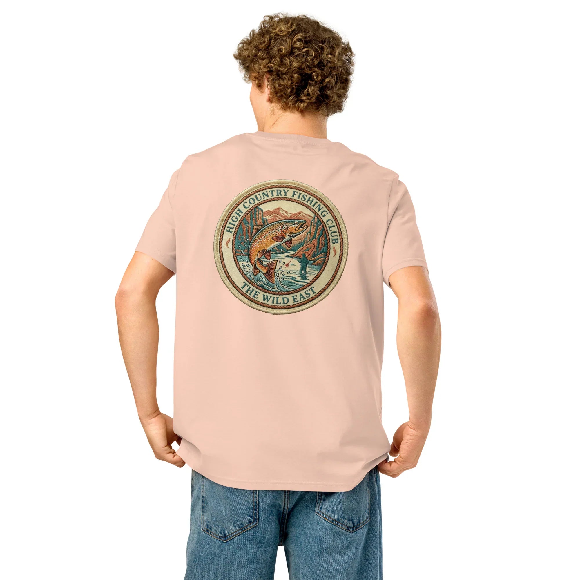 Organic Tee in Fraiche Peche on model with back circular fishing club graphic and fish